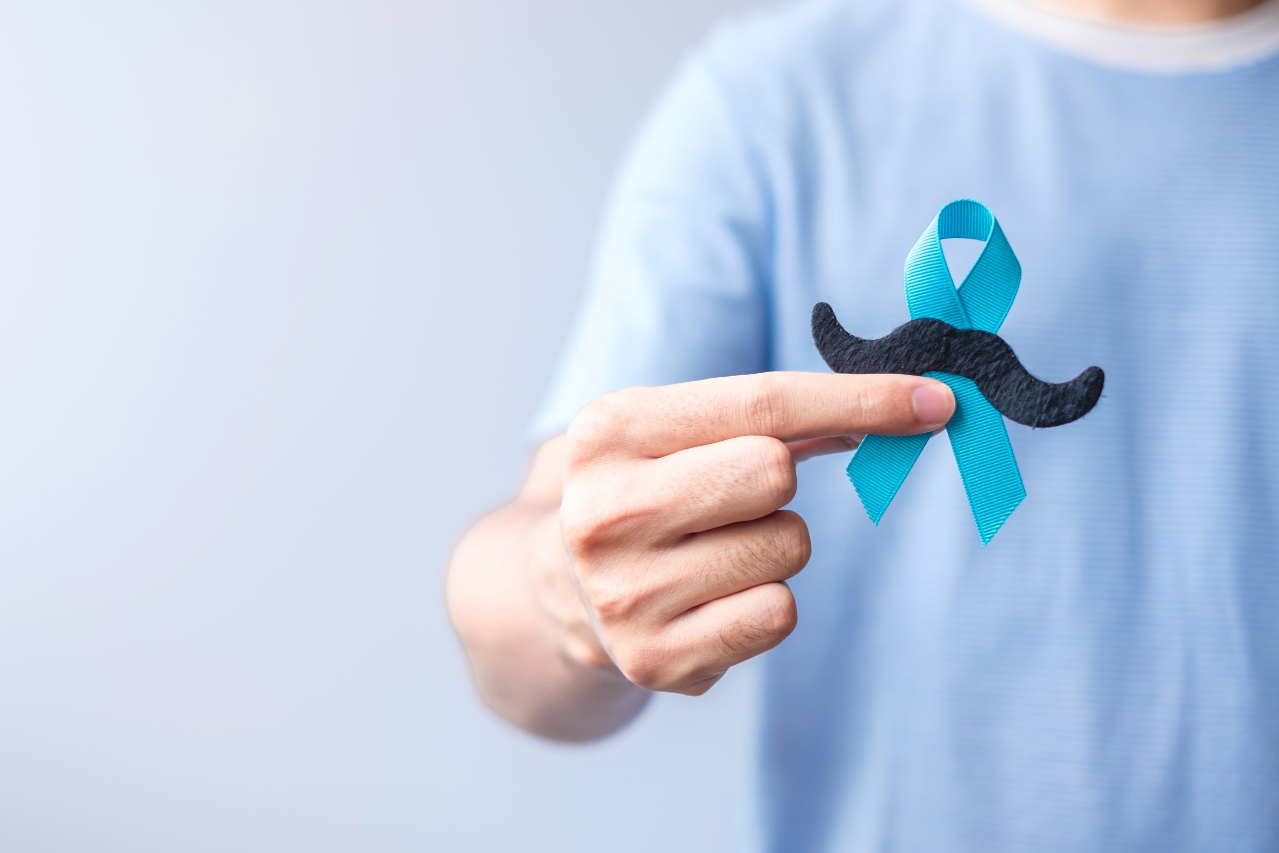 November Prostate Cancer Awareness month, Blue Ribbon with mustache for supporting people living and illness. Healthcare, International men, Father and World cancer day concept