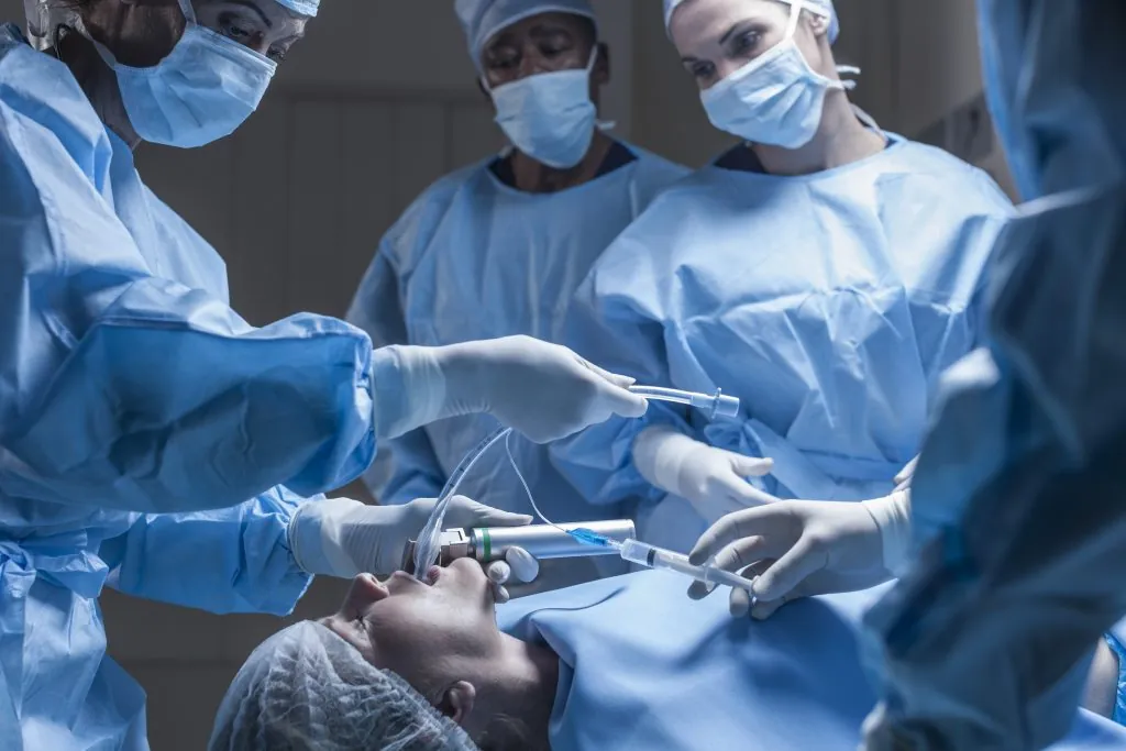Surgical team preparing patient for operation